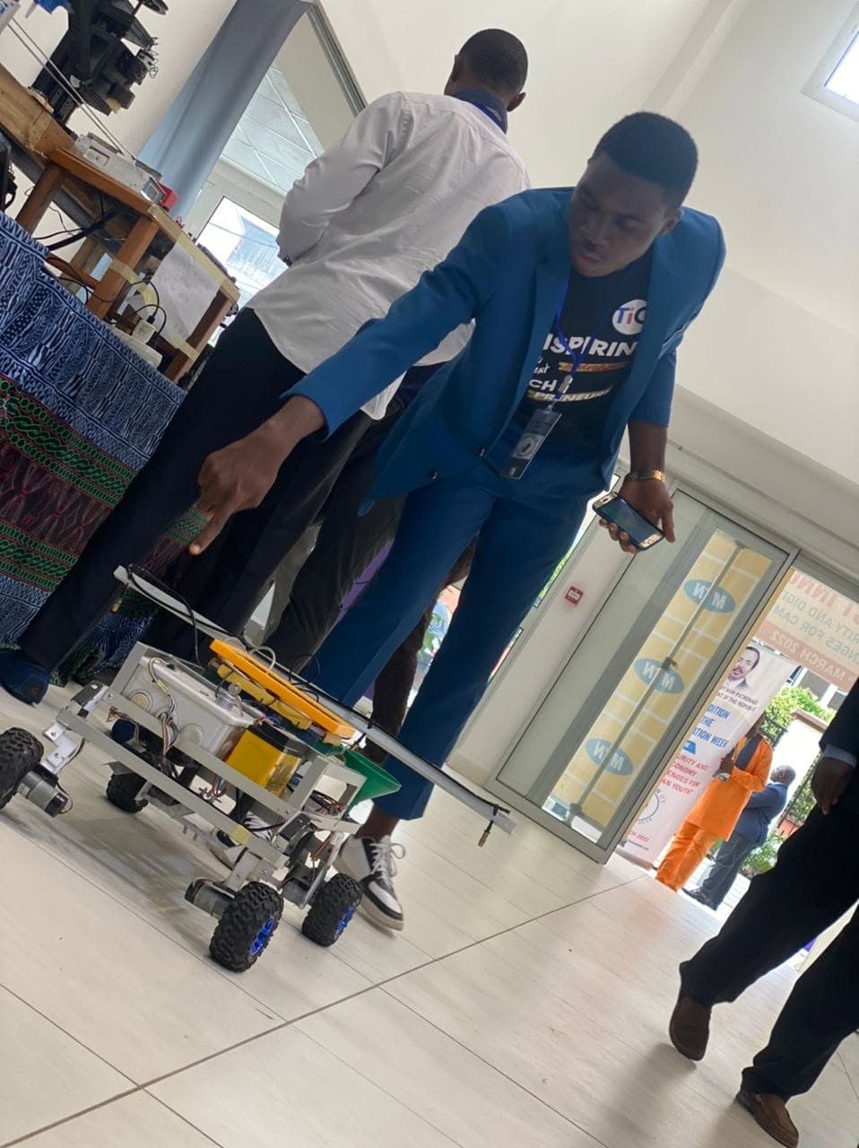 Chifen demonstrating the Agrobot prototype at Presidential ICT Week.
