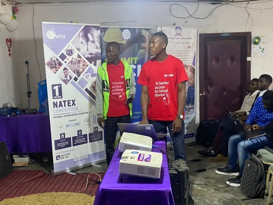The Ayodah team in red T-shirts at an outreach event.
